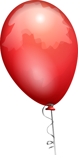 een rode ballon en een speld